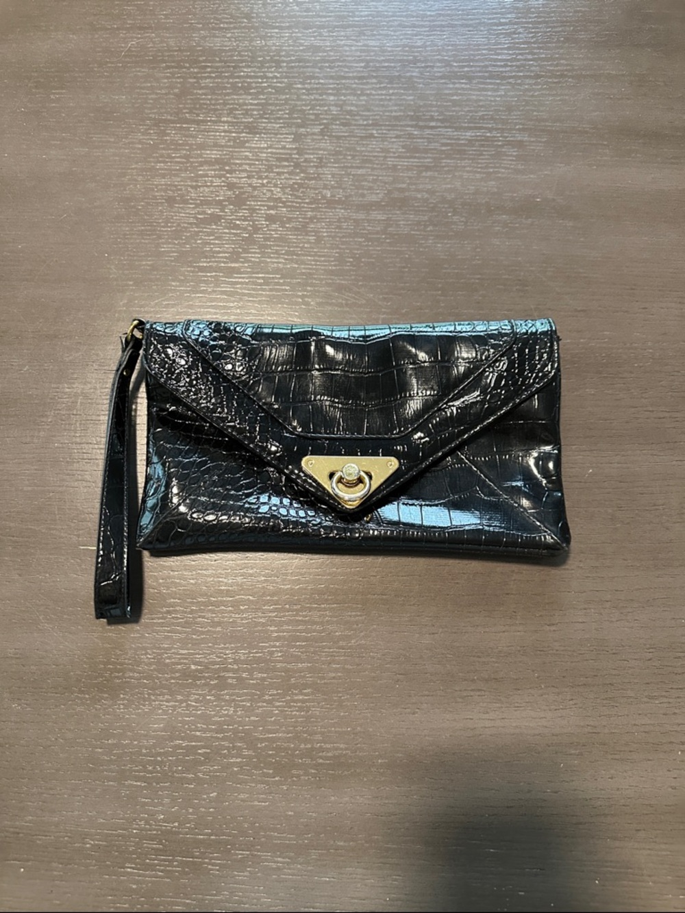 Patent leather like crocodile black clutch